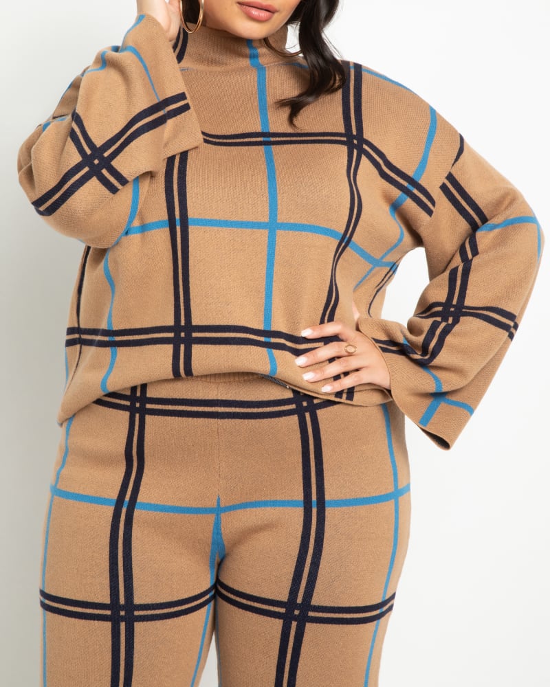 Front of a model wearing a size 14/16 Serena Windowpane Plaid Sweater in Windowpane Plaid by ELOQUII. | dia_product_style_image_id:242029